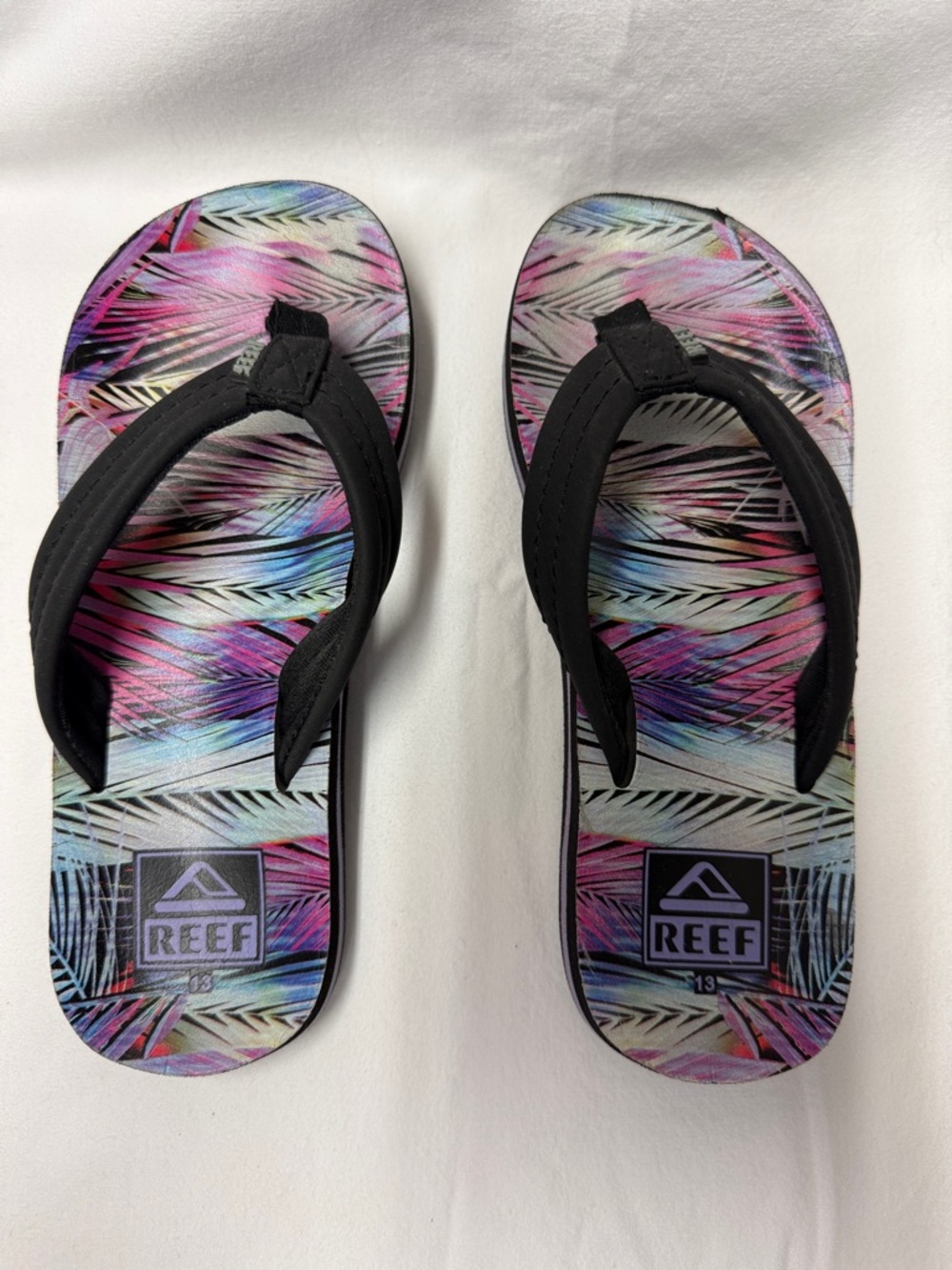 Reef Girls Flip Flops — Black Straps with Pink & Blue Palm Pattern